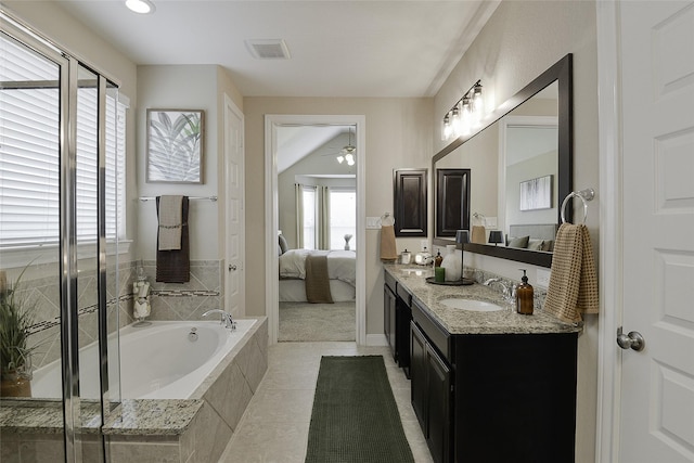 13705 Northline Lake Dr, Houston, TX 77044 - ensuite bathroom with double vanity, a bath, ceiling fan, and tile patterned flooring