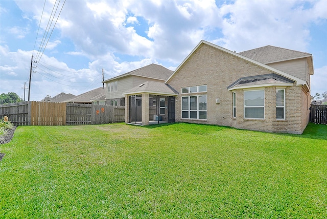 13705 Northline Lake Dr, Houston, TX 77044 - back of house with brick siding and a sunroom