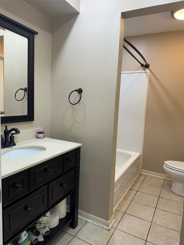 2316 Buchanan Dr, Baytown, TX 77520 - full bathroom with tile patterned flooring, vanity, toilet, shower / tub combination, and baseboards