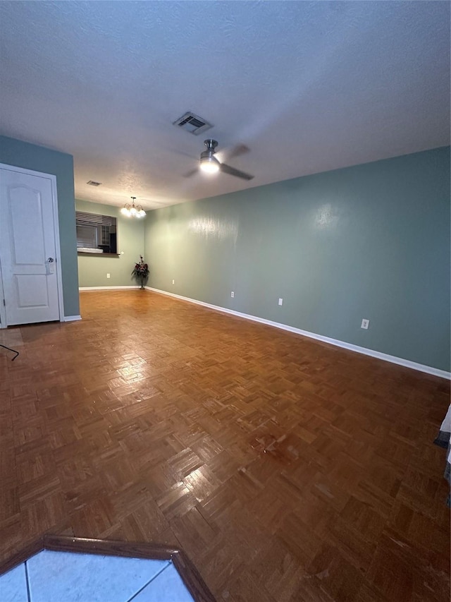 2316 Buchanan Dr, Baytown, TX 77520 - spare room featuring a ceiling fan, baseboards, and a chandelier