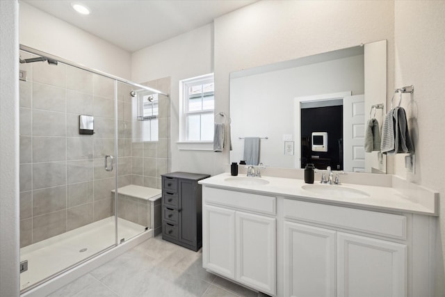 9954 Storehouse Dr, Houston, TX 77080 - bathroom featuring tile patterned floors, double vanity, and a shower stall
