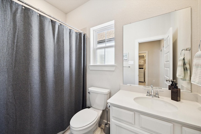 9954 Storehouse Dr, Houston, TX 77080 - bathroom with toilet, washer / clothes dryer, vanity, and a shower with curtain
