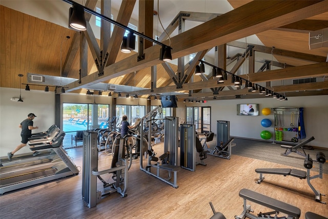 9954 Storehouse Dr, Houston, TX 77080 - exercise room with high vaulted ceiling, wood finished floors, and baseboards