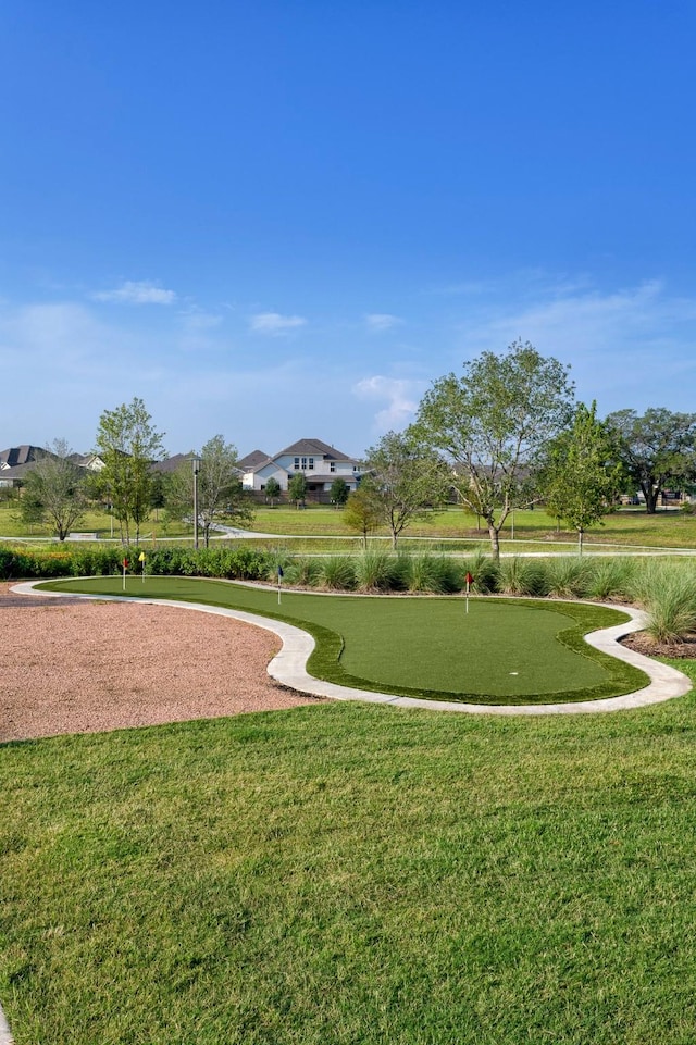 9954 Storehouse Dr, Houston, TX 77080 - view of property's community featuring a putting area and a yard