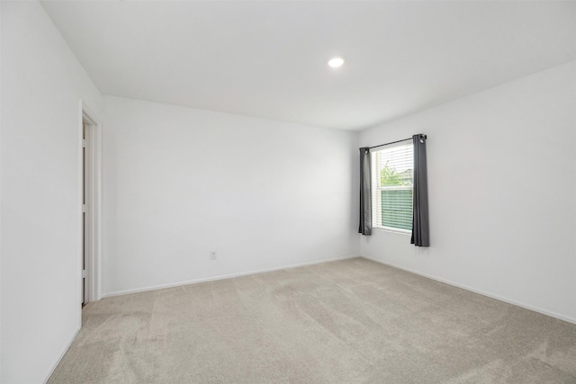 1491 Twilight Green Dr, Katy, TX 77493 - unfurnished room featuring light colored carpet, baseboards, and recessed lighting
