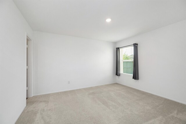 1491 Twilight Green Dr, Katy, TX 77493 - unfurnished room with light colored carpet, baseboards, and recessed lighting