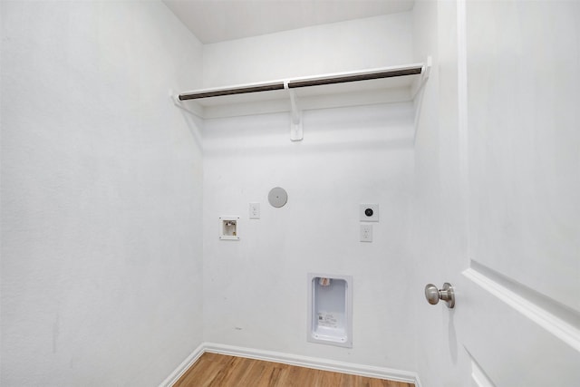 1491 Twilight Green Dr, Katy, TX 77493 - washroom featuring electric dryer hookup, wood finished floors, washer hookup, gas dryer hookup, and baseboards