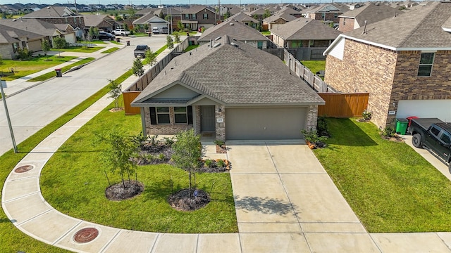 1491 Twilight Green Dr, Katy, TX 77493 - view of front of property with a residential view, brick siding, driveway, a shingled roof, and a garage