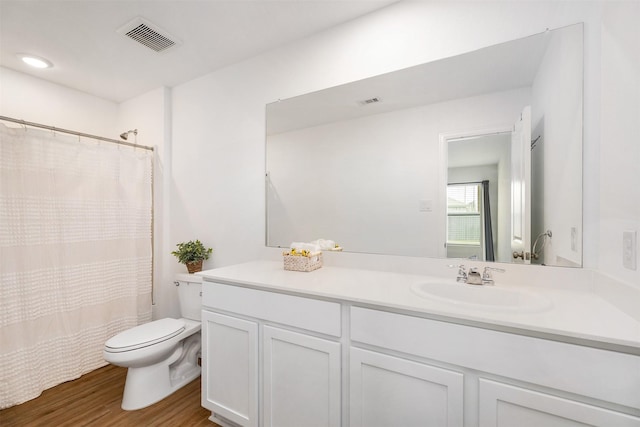 1491 Twilight Green Dr, Katy, TX 77493 - bathroom featuring toilet, vanity, wood finished floors, and a shower with shower curtain