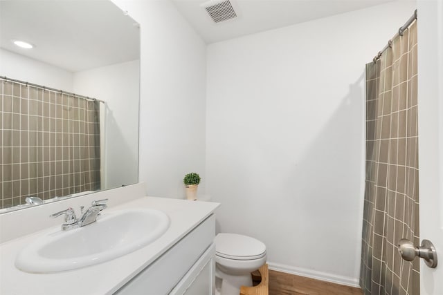 1491 Twilight Green Dr, Katy, TX 77493 - full bathroom featuring toilet, vanity, a shower, and wood finished floors