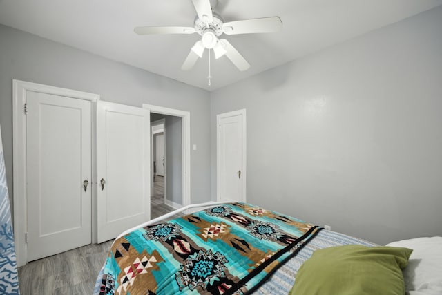 4404 Avenue N 1/2 Ave N 1/2, Galveston, TX 77550 - bedroom with light wood-type flooring, a ceiling fan, and baseboards