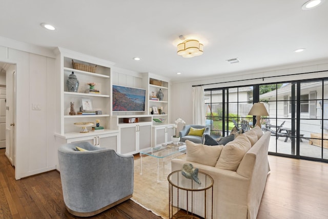 6147 Chevy Chase Dr, Houston, TX 77057 - living room with wood finished floors, recessed lighting, crown molding, and built in features