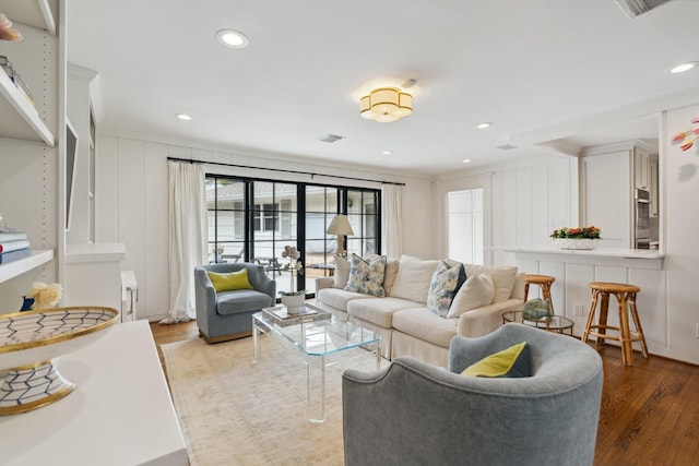 6147 Chevy Chase Dr, Houston, TX 77057 - living area with light wood-type flooring, a decorative wall, and recessed lighting