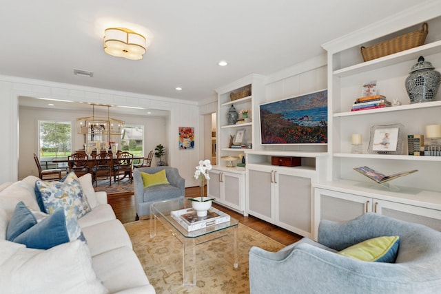 6147 Chevy Chase Dr, Houston, TX 77057 - living area with wood finished floors, recessed lighting, and crown molding