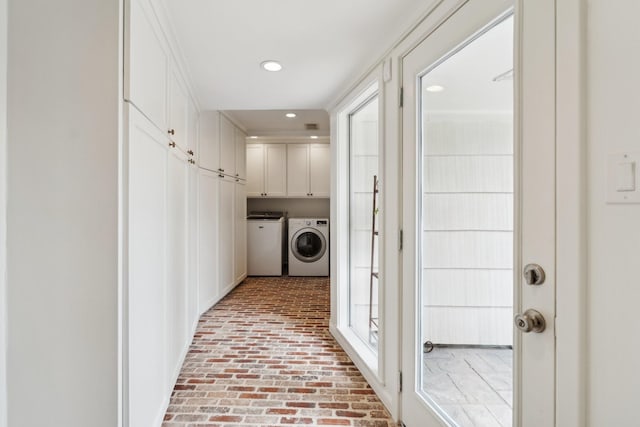 6147 Chevy Chase Dr, Houston, TX 77057 - laundry room with cabinet space, brick floors, washing machine and dryer, and recessed lighting
