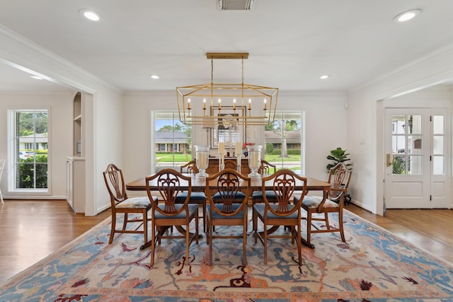 6147 Chevy Chase Dr, Houston, TX 77057 - dining room featuring ornamental molding, wood finished floors, a chandelier, baseboards, and recessed lighting