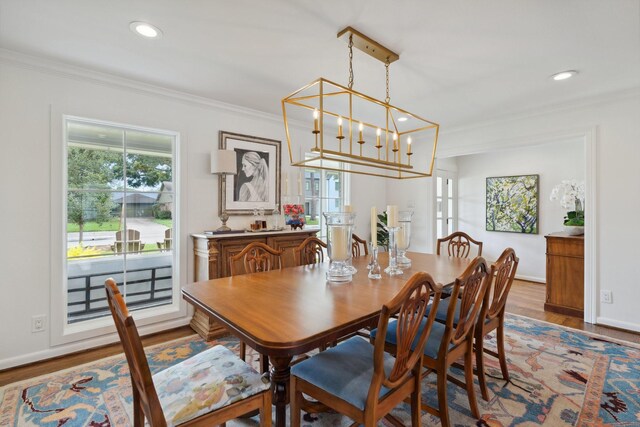6147 Chevy Chase Dr, Houston, TX 77057 - dining area featuring crown molding, wood finished floors, recessed lighting, a chandelier, and baseboards