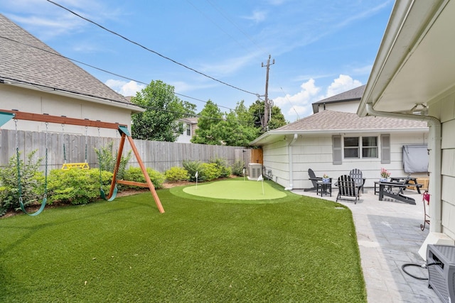 6147 Chevy Chase Dr, Houston, TX 77057 - view of yard featuring a putting green, a patio area, and cooling unit