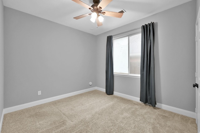 10 Hollylaurel Dr, The Woodlands, TX 77382 - unfurnished room with light carpet, a ceiling fan, and baseboards