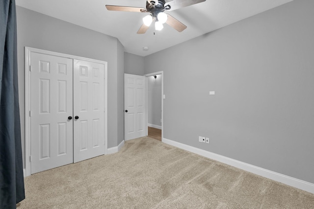 10 Hollylaurel Dr, The Woodlands, TX 77382 - unfurnished bedroom with carpet flooring, baseboards, a closet, and a ceiling fan