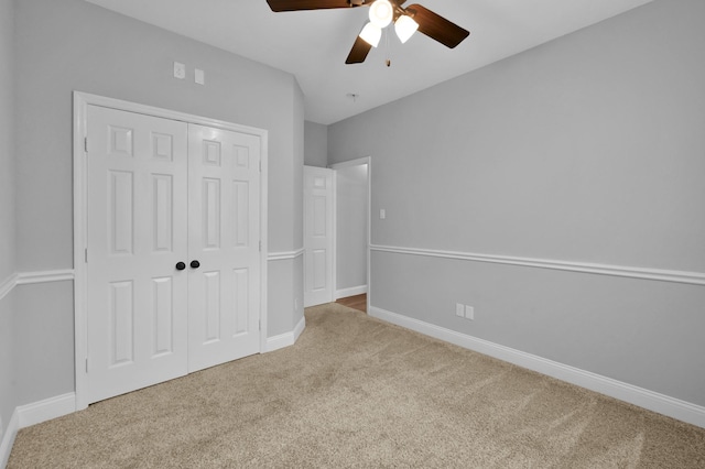 10 Hollylaurel Dr, The Woodlands, TX 77382 - unfurnished bedroom with carpet, a closet, baseboards, and a ceiling fan