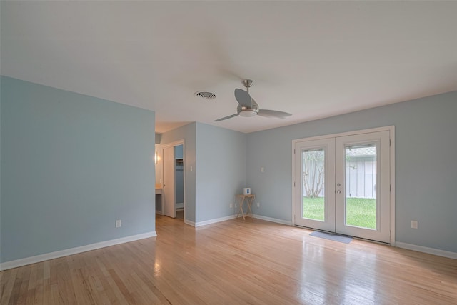 10126 Whiteside Ln, Houston, TX 77043 - empty room with french doors, light wood-style floors, a ceiling fan, and baseboards