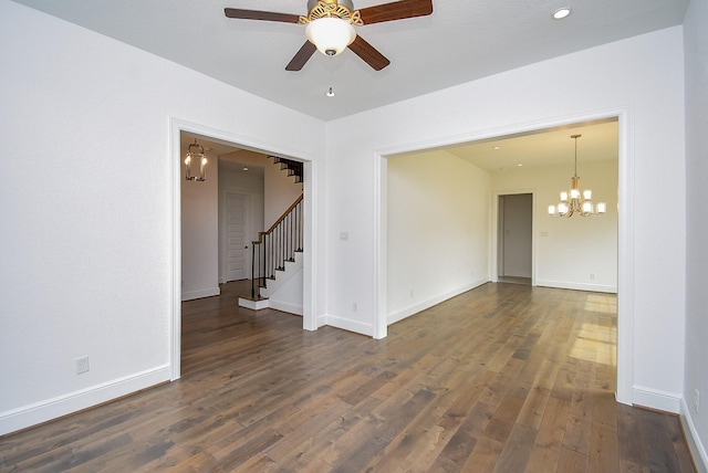 7818 Ludington Dr, Houston, TX 77071 - empty room featuring a chandelier, stairs, dark wood-type flooring, and baseboards