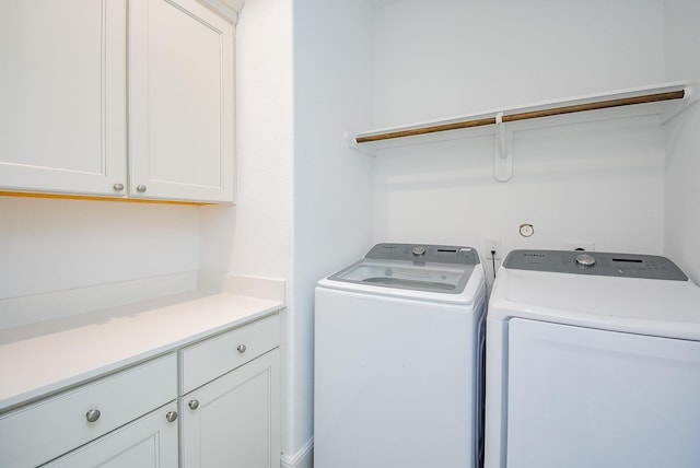7818 Ludington Dr, Houston, TX 77071 - laundry room featuring washing machine and dryer and cabinet space