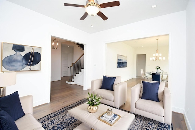 7818 Ludington Dr, Houston, TX 77071 - living room featuring wood finished floors, a chandelier, stairs, a ceiling fan, and baseboards