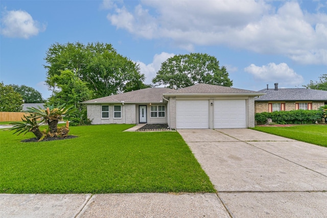10901 Mesquite Dr, La Porte, TX 77571 - single story home with an attached garage, concrete driveway, a front yard, and brick siding