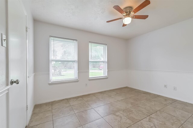 10901 Mesquite Dr, La Porte, TX 77571 - empty room featuring ceiling fan and baseboards