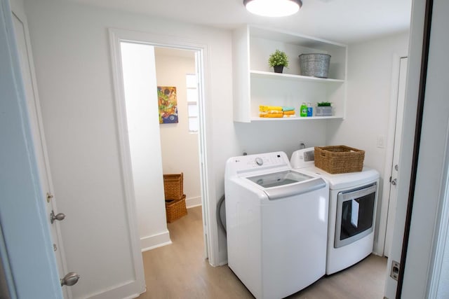 2302 Hewitt Dr, Houston, TX 77018 - laundry room featuring separate washer and dryer and light wood-style flooring