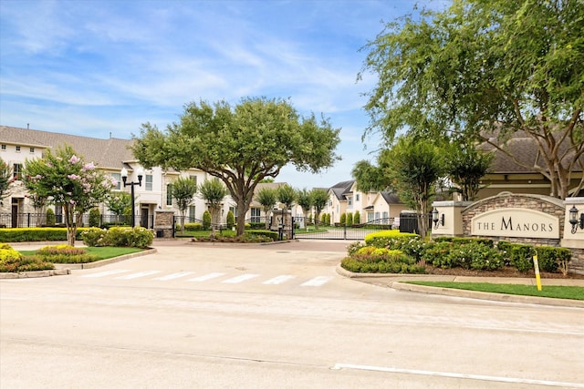 4303 Stonebrook Ln, Missouri City, TX 77459 - view of concrete street with a residential view, curbs, a gate, and a gated entry