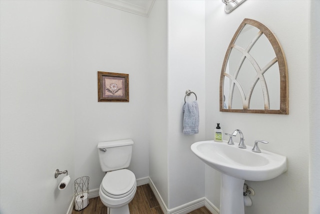 4303 Stonebrook Ln, Missouri City, TX 77459 - half bath with toilet, wood finished floors, baseboards, and ornamental molding