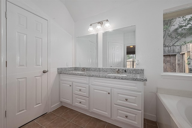 7119 Piney Meadow Ct, Houston, TX 77041 - bathroom featuring double vanity, a bath, and tile patterned flooring