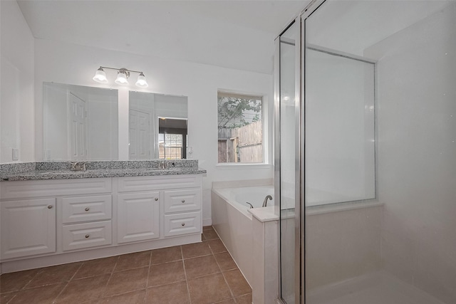 7119 Piney Meadow Ct, Houston, TX 77041 - bathroom featuring double vanity, a stall shower, a garden tub, and tile patterned floors