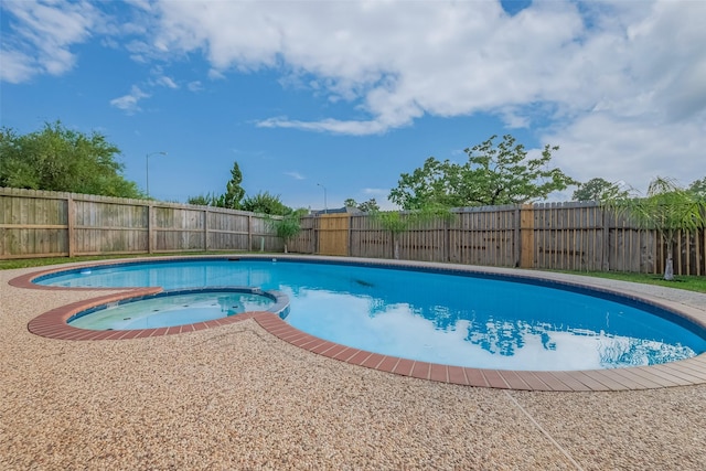 7119 Piney Meadow Ct, Houston, TX 77041 - view of pool with a fenced backyard and a pool with connected hot tub