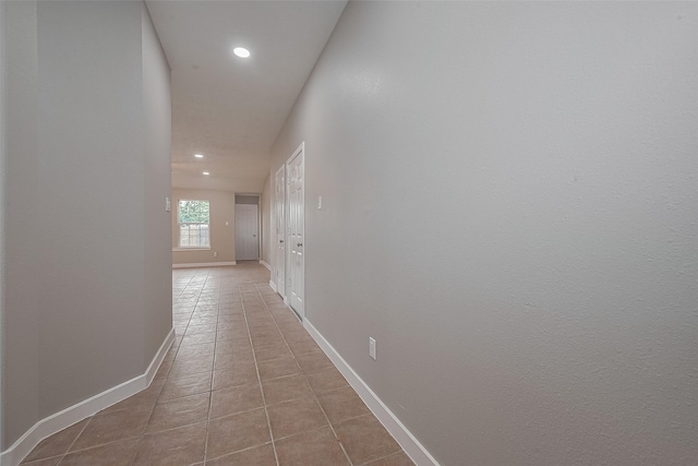 7119 Piney Meadow Ct, Houston, TX 77041 - hallway with recessed lighting, light tile patterned flooring, and baseboards