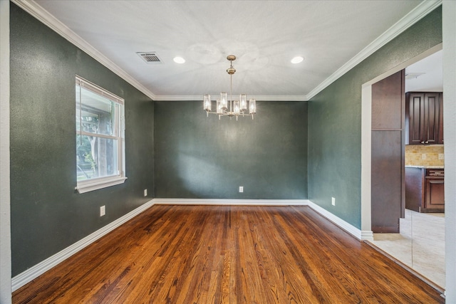 5211 W Bellfort Ave, Houston, TX 77035 - unfurnished room featuring wood finished floors, a chandelier, ornamental molding, baseboards, and recessed lighting