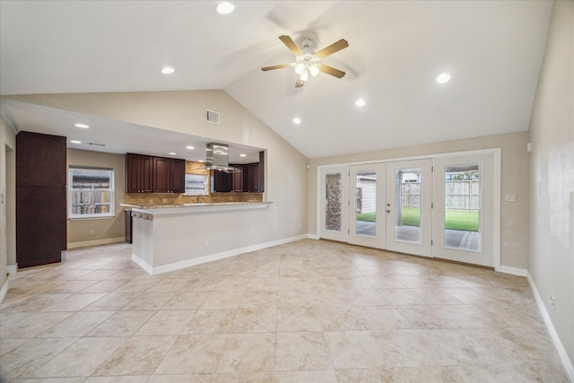 5211 W Bellfort Ave, Houston, TX 77035 - unfurnished living room featuring vaulted ceiling, ceiling fan, light tile patterned floors, french doors, and recessed lighting