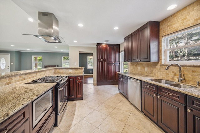 5211 W Bellfort Ave, Houston, TX 77035 - kitchen featuring stainless steel appliances, a sink, island range hood, tasteful backsplash, and light stone counters