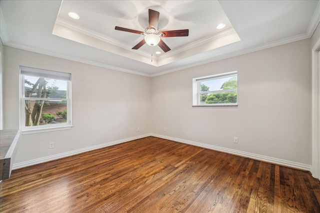 5211 W Bellfort Ave, Houston, TX 77035 - empty room with healthy amount of natural light, wood finished floors, a raised ceiling, crown molding, and a ceiling fan