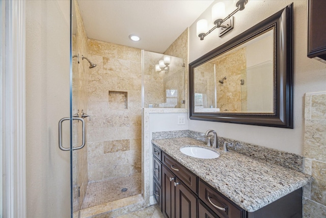 5211 W Bellfort Ave, Houston, TX 77035 - bathroom featuring a shower stall and vanity