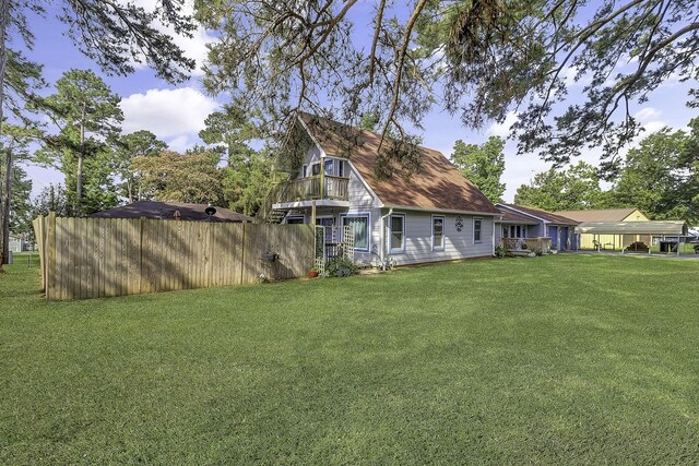 1239 Indian Hill Blvd, Livingston, TX 77351 - view of side of property featuring a balcony