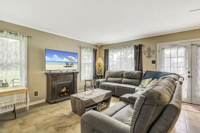1239 Indian Hill Blvd, Livingston, TX 77351 - living room with healthy amount of natural light, crown molding, a warm lit fireplace, and baseboards
