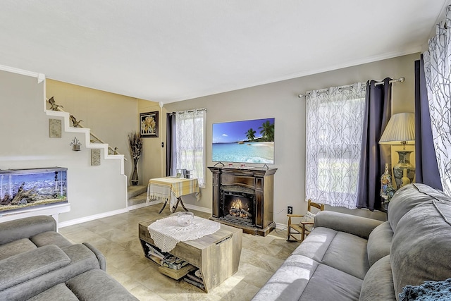 1239 Indian Hill Blvd, Livingston, TX 77351 - living area featuring stairway, a warm lit fireplace, baseboards, and ornamental molding