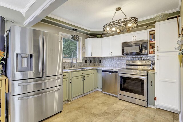 1239 Indian Hill Blvd, Livingston, TX 77351 - kitchen featuring stainless steel appliances, a sink, tasteful backsplash, ornamental molding, and white cabinets