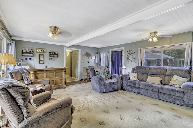 1239 Indian Hill Blvd, Livingston, TX 77351 - living area with ceiling fan, healthy amount of natural light, beamed ceiling, and crown molding