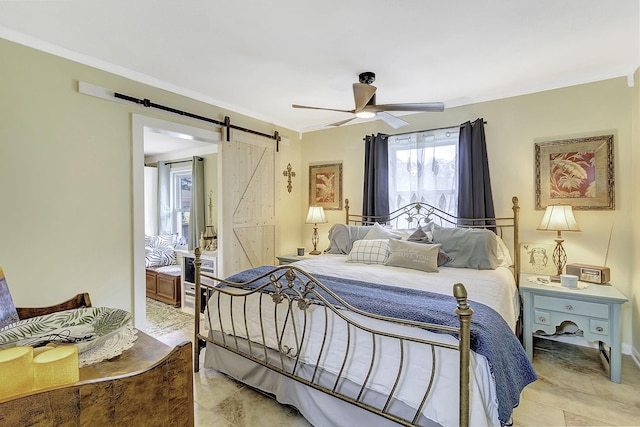 1239 Indian Hill Blvd, Livingston, TX 77351 - bedroom featuring a barn door, ornamental molding, and ceiling fan