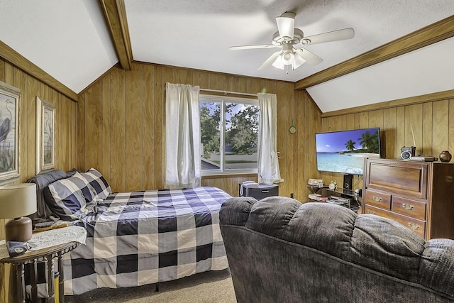 1239 Indian Hill Blvd, Livingston, TX 77351 - carpeted bedroom featuring lofted ceiling, wood walls, ceiling fan, and a textured ceiling